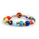 Bracciale da uomo che incarna la moda maschile con Murrine veneziane, di fattura artigianale e chiusura a bottone, un compagno di viaggio prezioso
